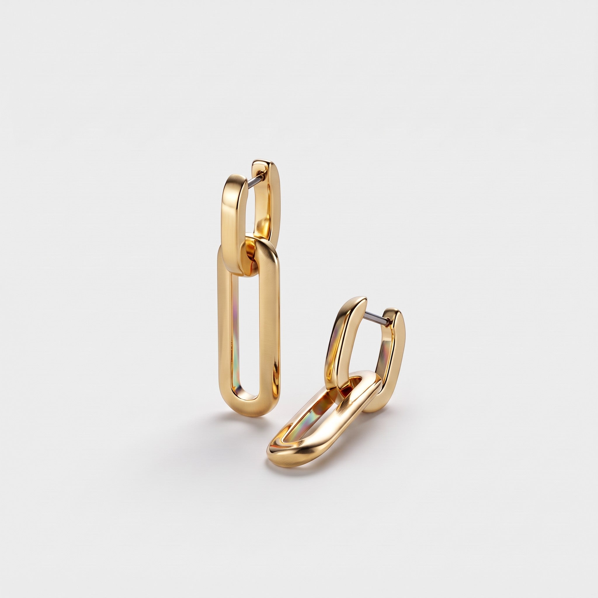 Shop Rescue Spa Teeni 14k gold-dipped brass huggie earrings with detachable polished link drops.