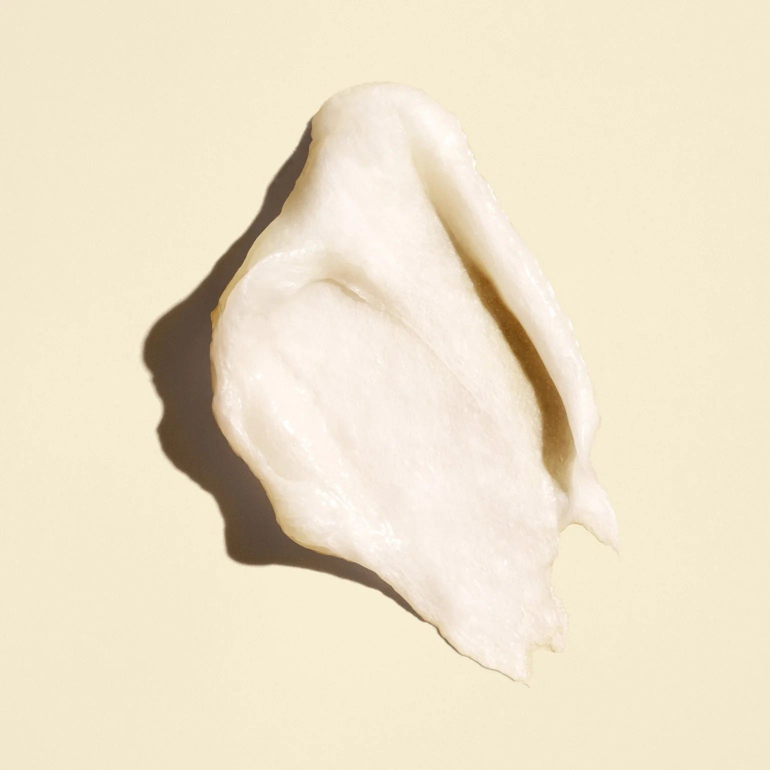 Shop Rescue Spa Gold Lust Transformative Mask creamy white hair treatment texture swatch on a light beige background