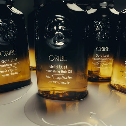 Shop Rescue Spa Oribe Gold Lust Nourishing Hair Oil in amber glass bottles with gold liquid.