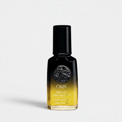 Shop Rescue Spa Oribe Gold Lust Nourishing Hair Oil, a luxurious amber-colored hair oil in a black bottle with gold accents.