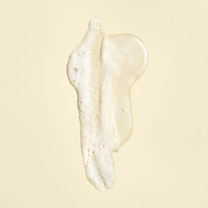 Shop Rescue Spa Oribe Gold Lust Repair and Restore Shampoo texture showing a clear, foaming gel consistency.