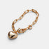 Shop Rescue Spa gold paperclip chain bracelet featuring a polished puffy heart charm on a white background