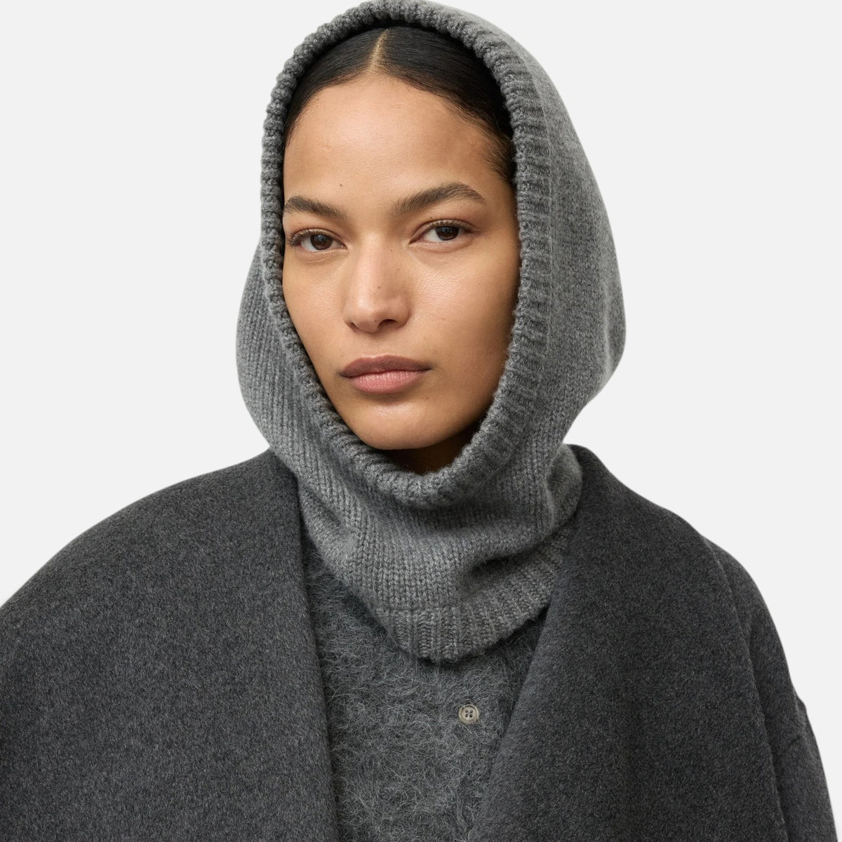 Shop Rescue Spa chunky knit grey cashmere balaclava worn by a model in a matching grey coat