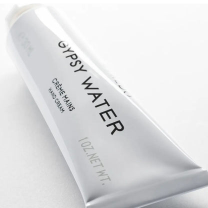 Shop Rescue Spa Gypsy Water hand cream tube with notes of bergamot, pine needle, sandalwood, and amber.