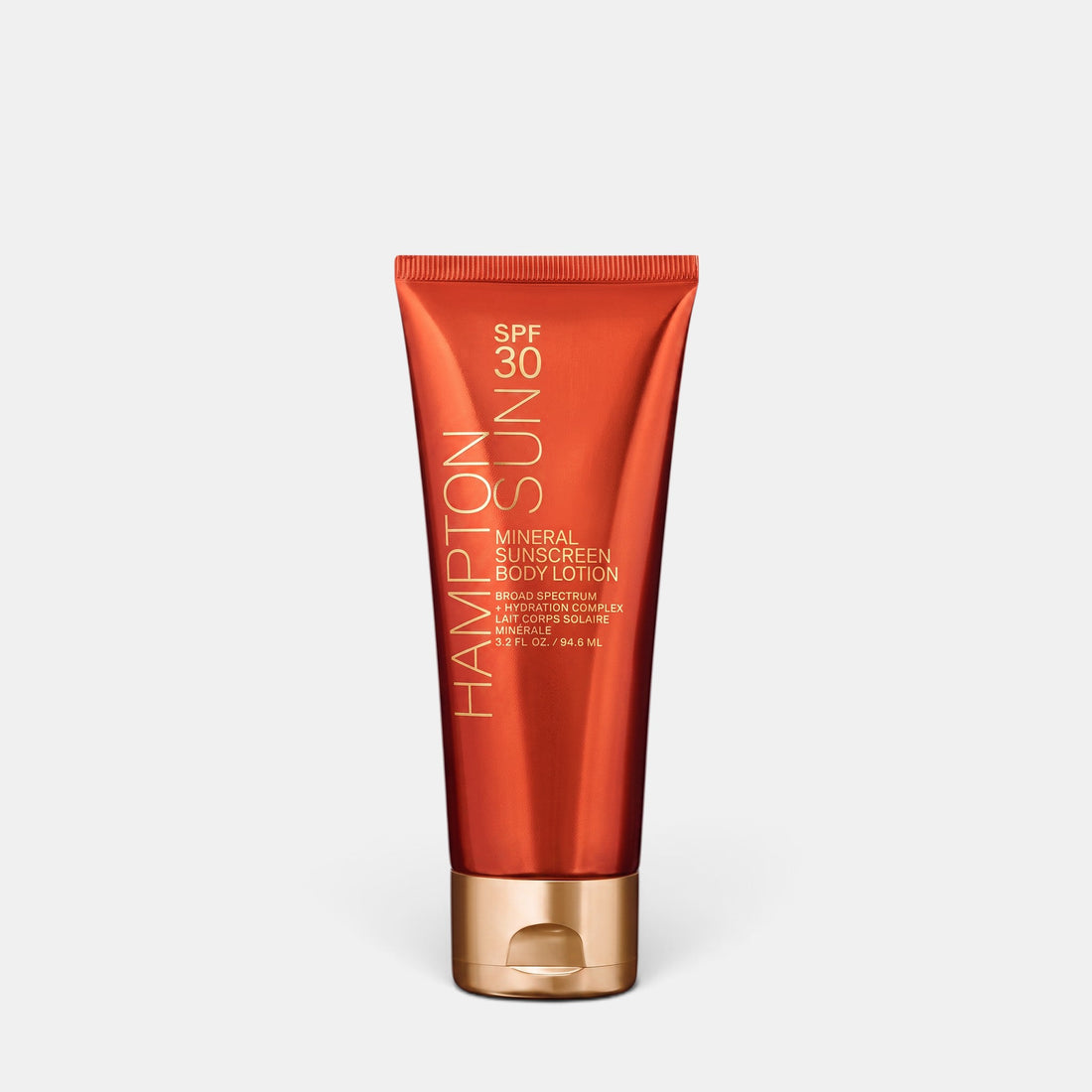Shop Rescue Spa Hampton Sun SPF 30 mineral body lotion in a metallic orange tube with a gold cap.