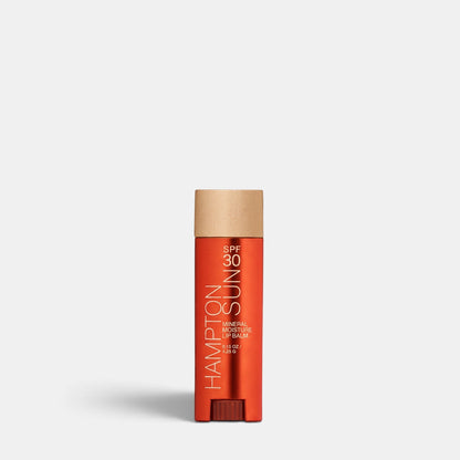 Shop Rescue Spa Hampton Sun SPF 30 mineral moisture lip balm in a sleek orange tube with a textured gold cap.