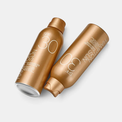 Shop Rescue Spa Hampton Sun SPF 30 UV-Advanced Mist sunscreen spray bottles in metallic gold packaging