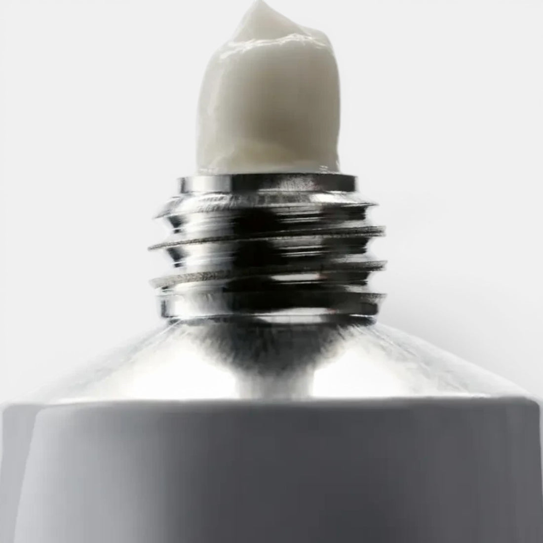 Shop Rescue Spa Hand and Nail Cream Suede, white cream in a silver metal tube, 100ml