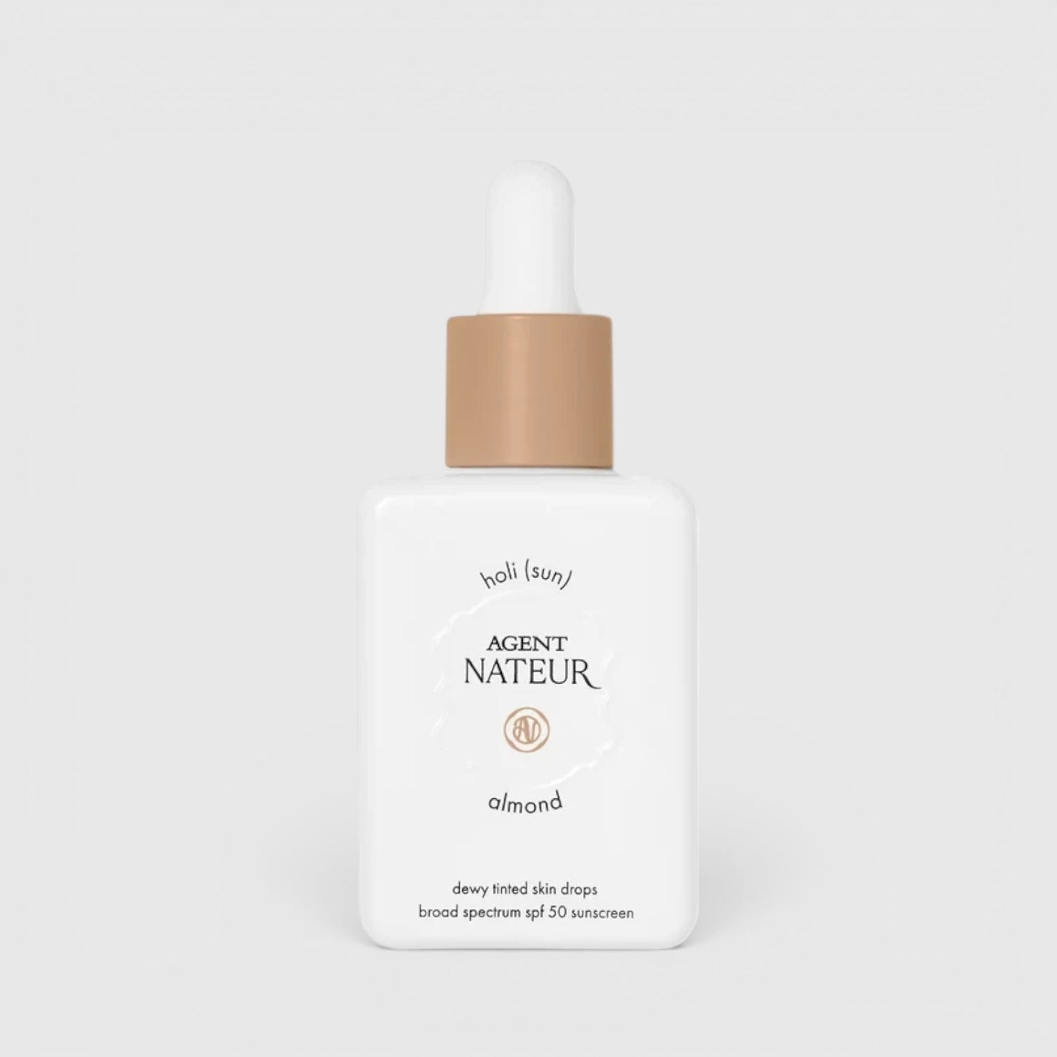 Shop Rescue Spa Agent Nateur Holi (sun) SPF 50 dewy tinted skin drops in almond shade in a white dropper bottle.