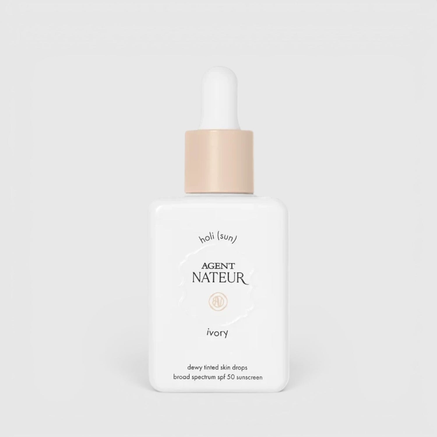 Shop Rescue Spa Holi (sun) SPF 50 dewy tinted skin drops in ivory shade in a white glass bottle with a dropper cap.