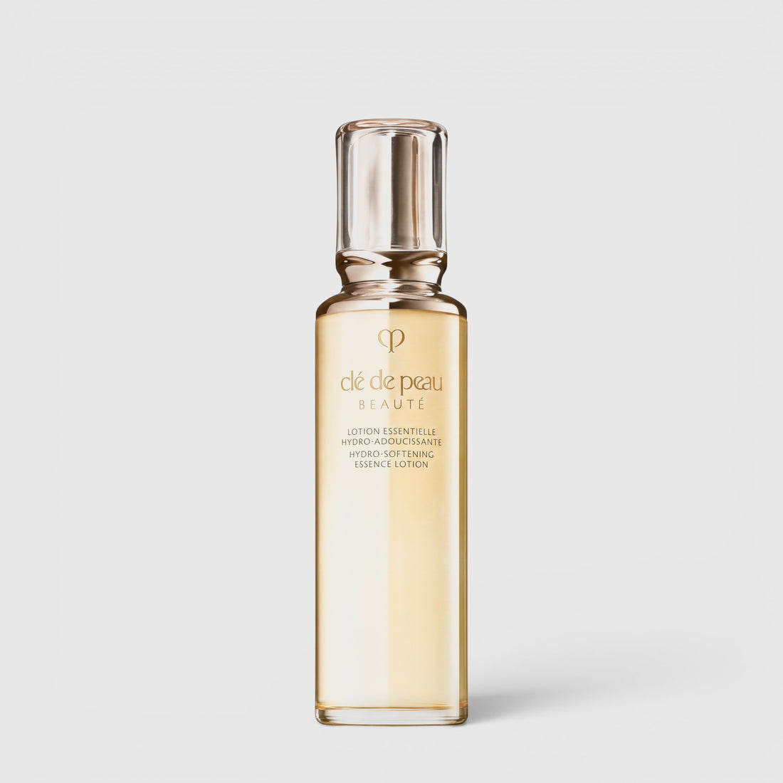 Shop Rescue Spa Cle de Peau Beaute Hydro-Softening Essence Lotion in a clear gold bottle for hydrating dry skin.