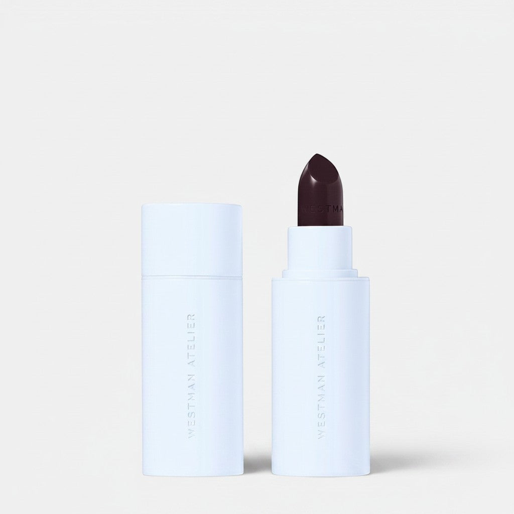 Shop Rescue Spa Hydrobalm Tinted Lipstick in a deep berry shade with a white minimalist tube and cap