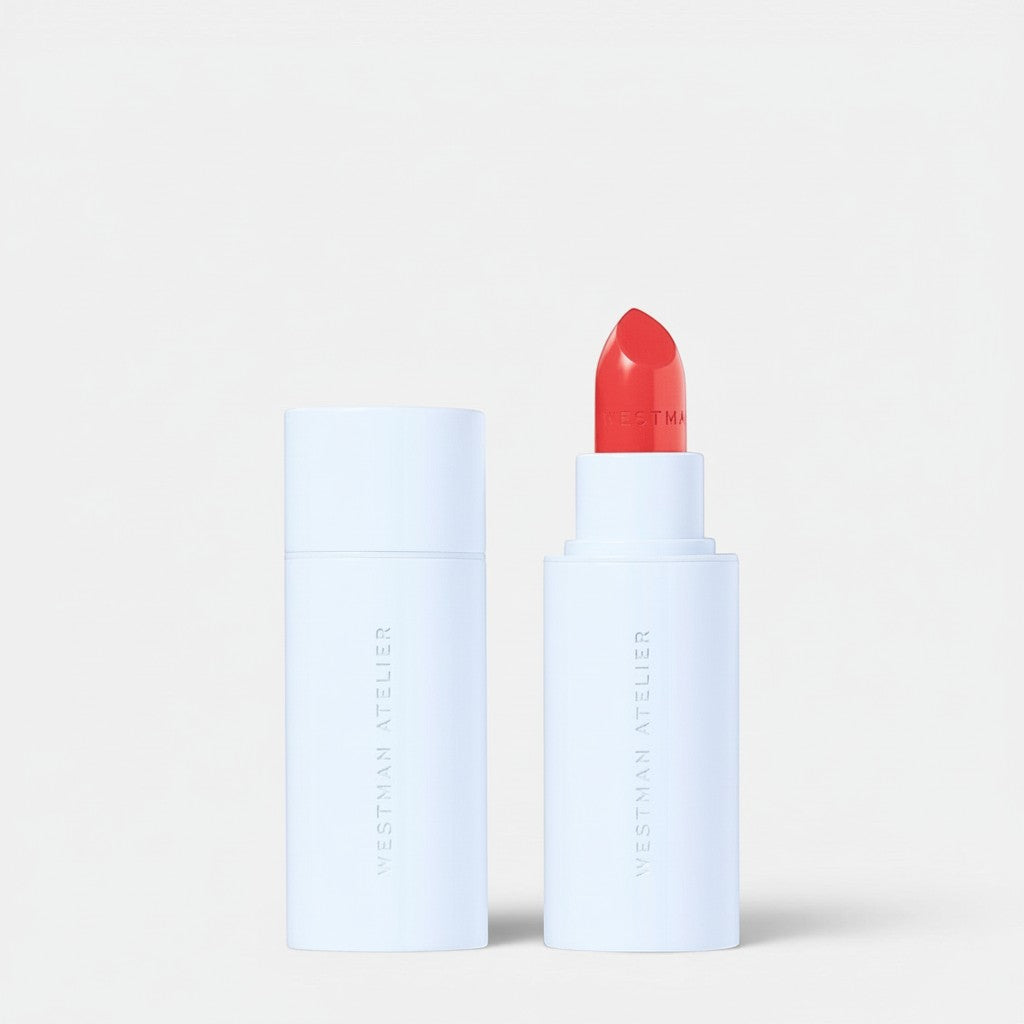 Shop Rescue Spa Hydrobalm Tinted Lipstick in a bright coral shade with a sleek white magnetic case.