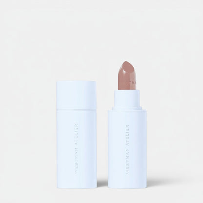 Shop Rescue Spa Hydrobalm Tinted Lipstick in a neutral nude shade, housed in a white tube with a matching cap.