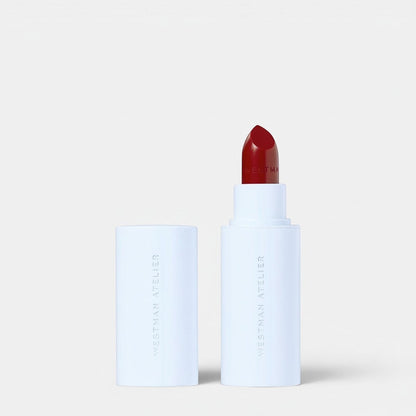 Shop Rescue Spa Hydrobalm Tinted Lipstick in a deep red shade with a white minimalist tube and cap