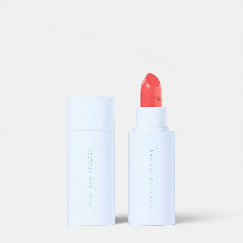 Shop Rescue Spa Hydrobalm Tinted Lipstick in a vibrant coral shade with a sleek white magnetic case.