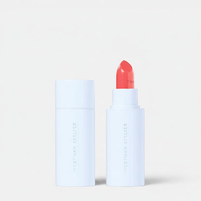 Shop Rescue Spa Hydrobalm Tinted Lipstick in a vibrant coral shade with a sleek white magnetic case.