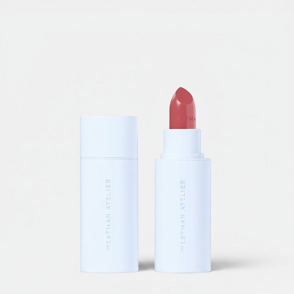 Shop Rescue Spa Hydrobalm Tinted Lipstick in a sleek white tube with a soft rose-toned balm and branded cap.