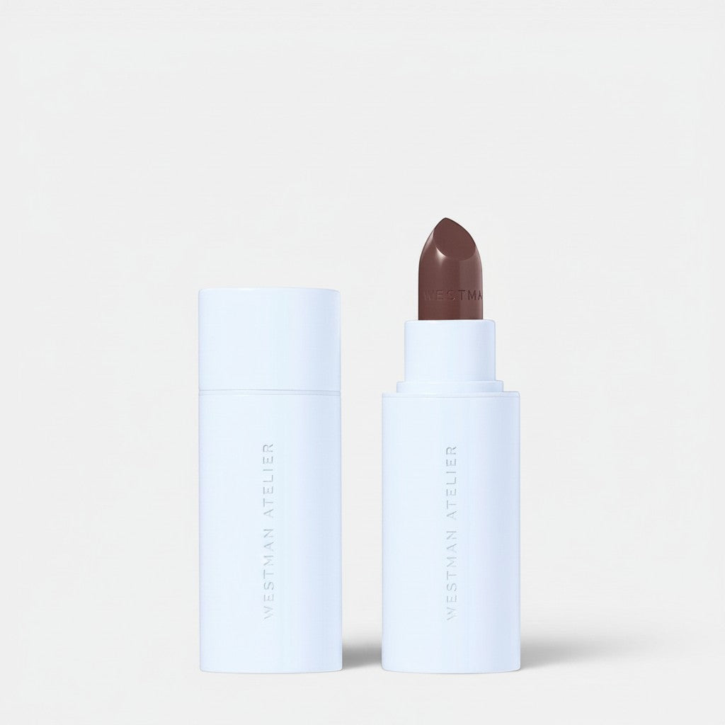 Shop Rescue Spa Hydrobalm Tinted Lipstick in a deep brown shade with a sleek white applicator tube