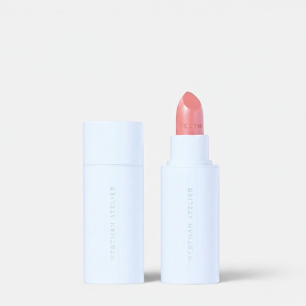 Shop Rescue Spa Hydrobalm Tinted Lipstick in a soft pink shade with a sleek white applicator tube