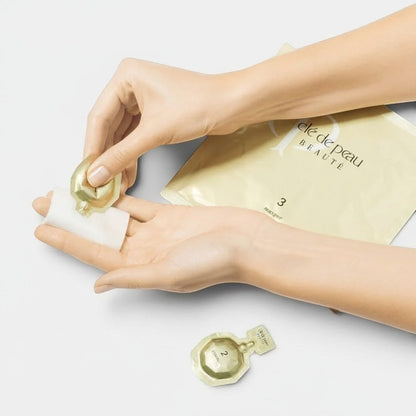 Shop Rescue Spa Cle de Peau Beaute Illuminating Concentrate 3-step face and eye mask treatment set in gold packaging