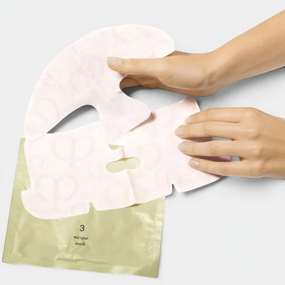 Shop Rescue Spa Illuminating Concentrate 3-step face and eye mask set with a pale pink sheet mask being applied