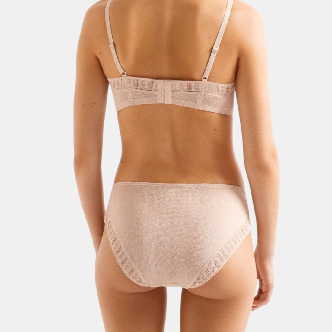 Shop Rescue Spa Infime full-cup bra and matching panty set in beige with delicate trim details, back view.