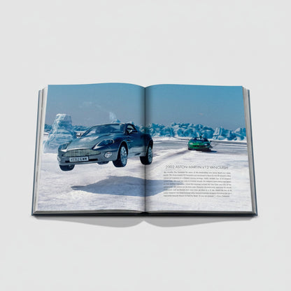 Shop Rescue Spa James Bond Cars book featuring a 2002 Aston Martin V12 Vanquish in a snowy landscape.