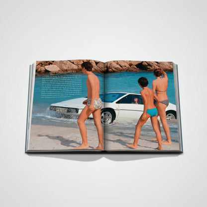 James Bond Cars book featuring a white 1976 Lotus Esprit S1 on a beach with three people. Shop Rescue Spa.