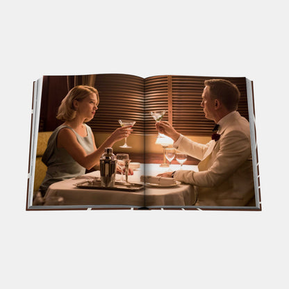 Shop Rescue Spa James Bond Style hardcover book open to a scene of Daniel Craig and Lea Seydoux dining together.