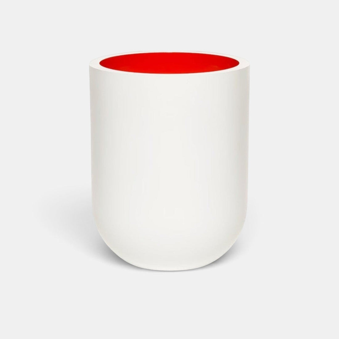 Shop Rescue Spa Jurassic Flower scented candle in a matte white porcelain vessel with a vibrant red interior.