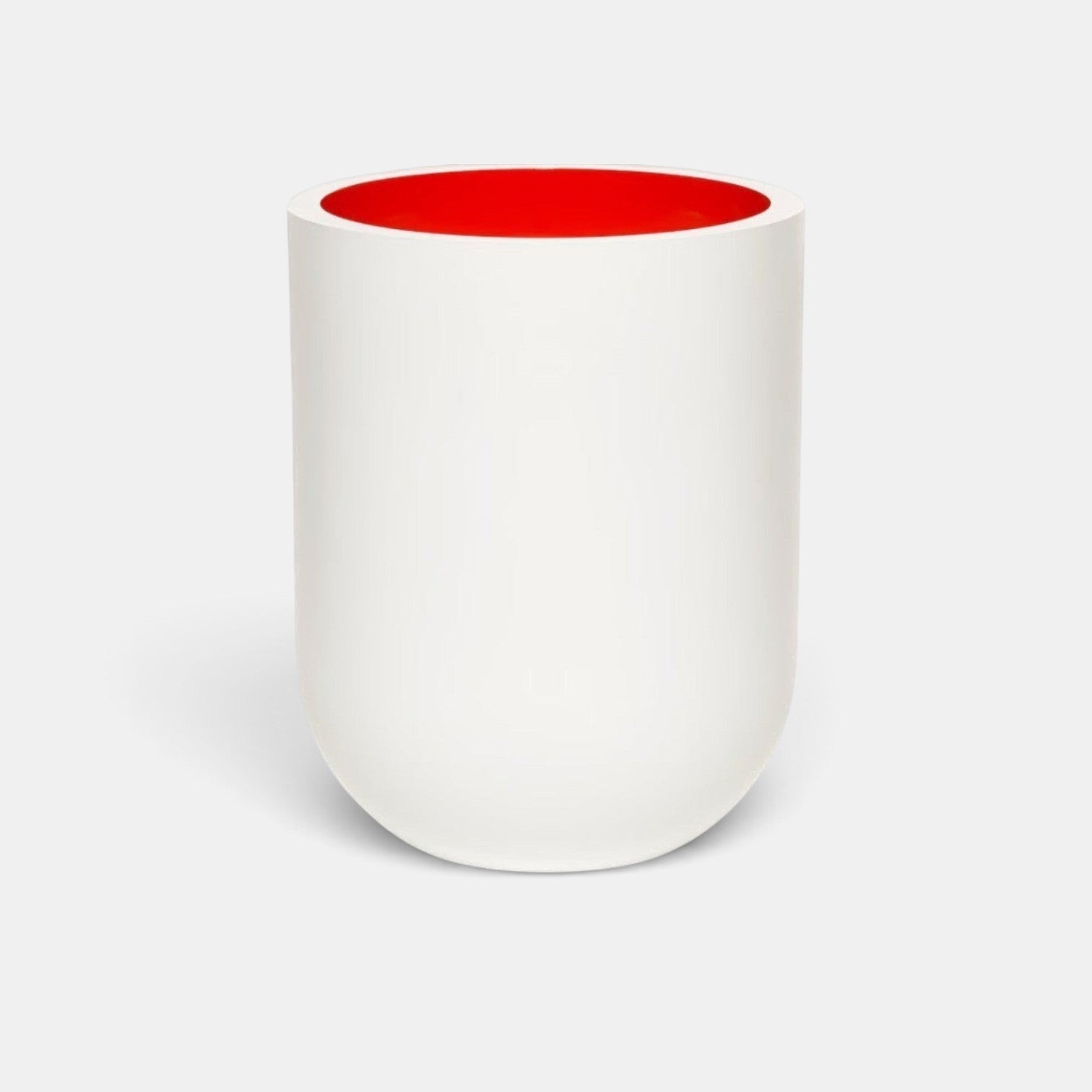 Shop Rescue Spa Jurassic Flower scented candle in a matte white porcelain vessel with a vibrant red interior.