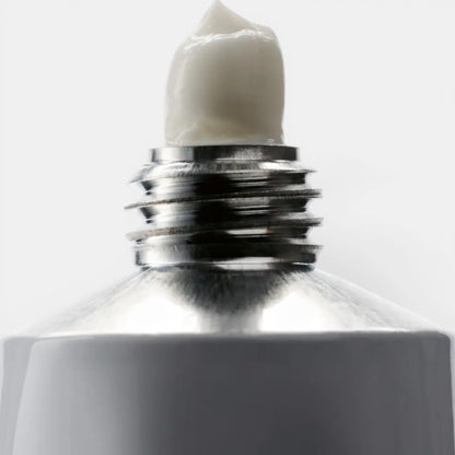 Shop Rescue Spa La Tulipe hand cream in a travel-sized tube, white cream dispensed.