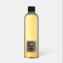 Shop Rescue Spa Dr. Vranjes Leather Oud room diffuser refill bottle with golden fragrance liquid and black cap.