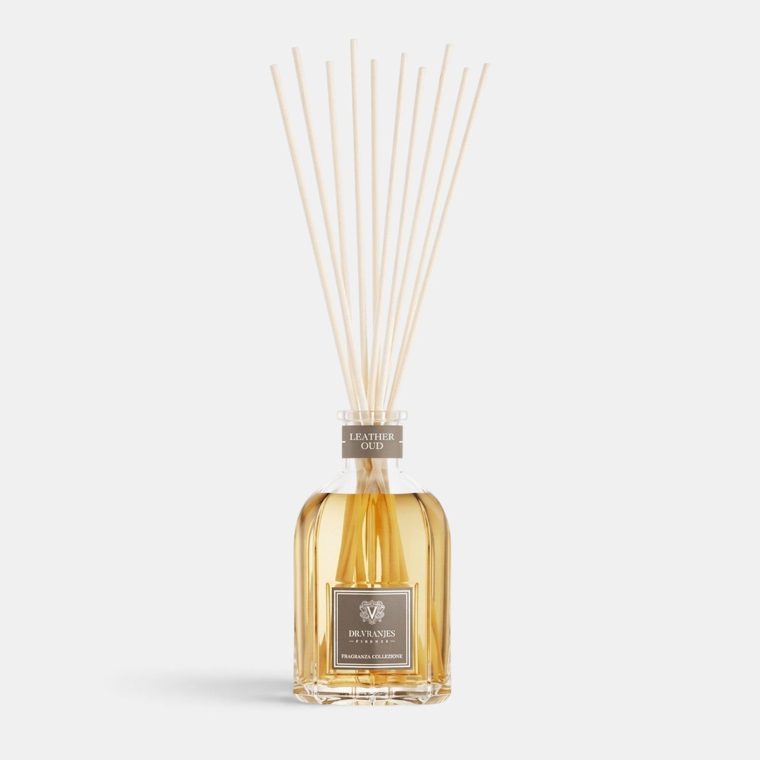 Shop Rescue Spa Leather Oud room diffuser in a glass bottle with reed sticks, featuring a warm amber fragrance oil.