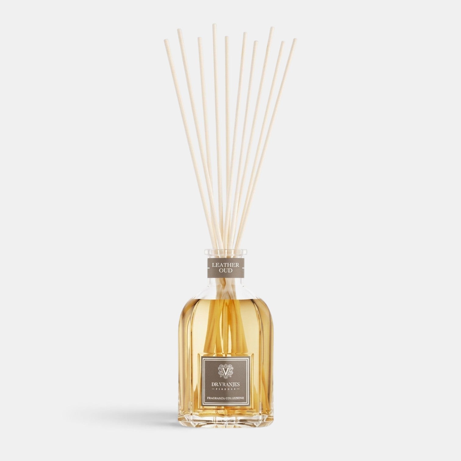 Shop Rescue Spa Leather Oud room diffuser in a glass bottle with reed sticks, featuring a warm amber fragrance oil.