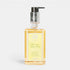 Shop Rescue Spa Lemon, Verbena & Cedar hand and body wash in a clear bottle with a decorative silver pump dispenser.