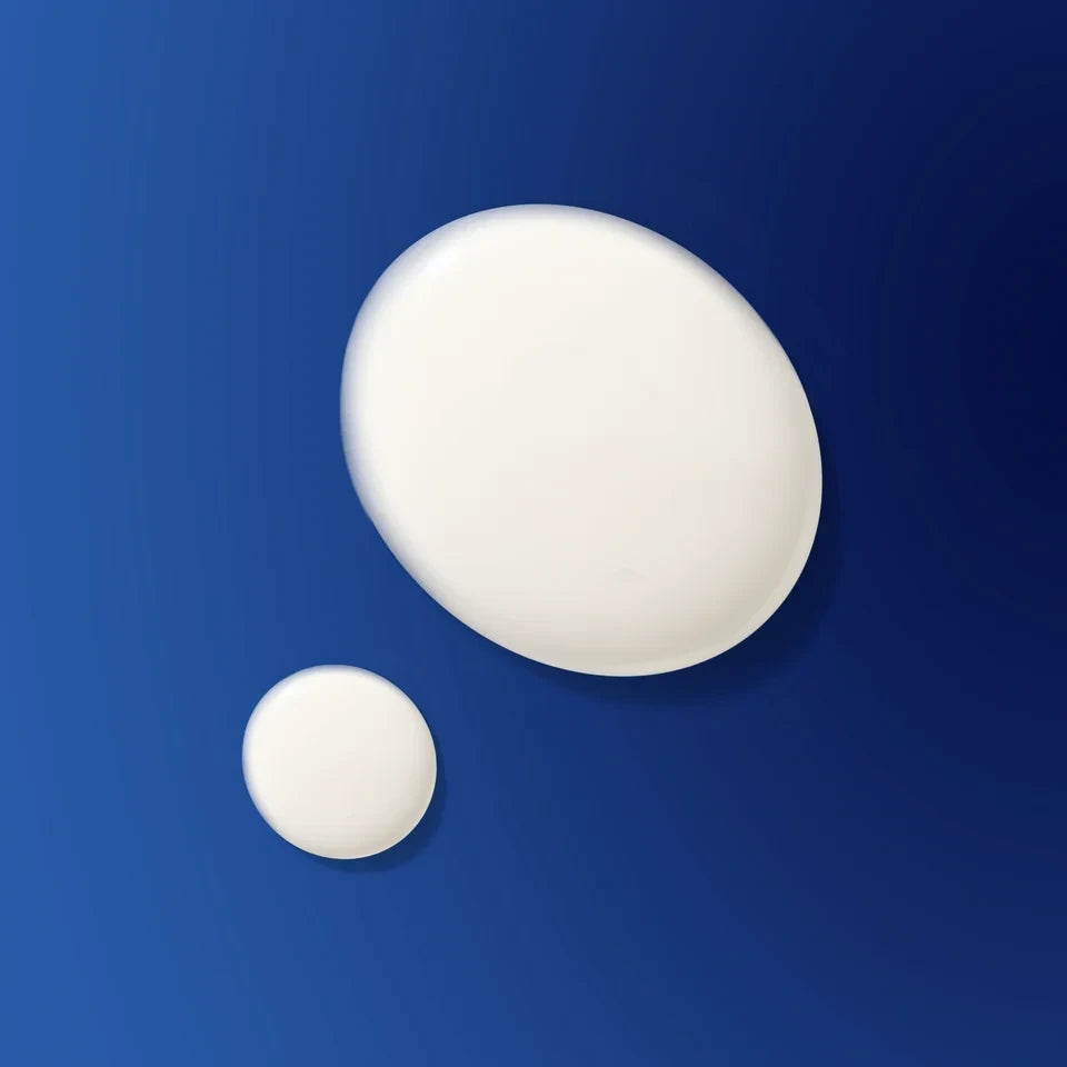 Shop Rescue Spa The Light Cream moisturizer texture drops on a deep blue background