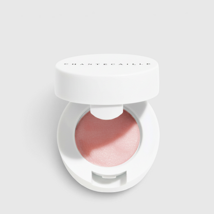 Shop Rescue Spa Lip Potion in a white compact with a soft pink, nourishing balm for hydrated and smooth lips.
