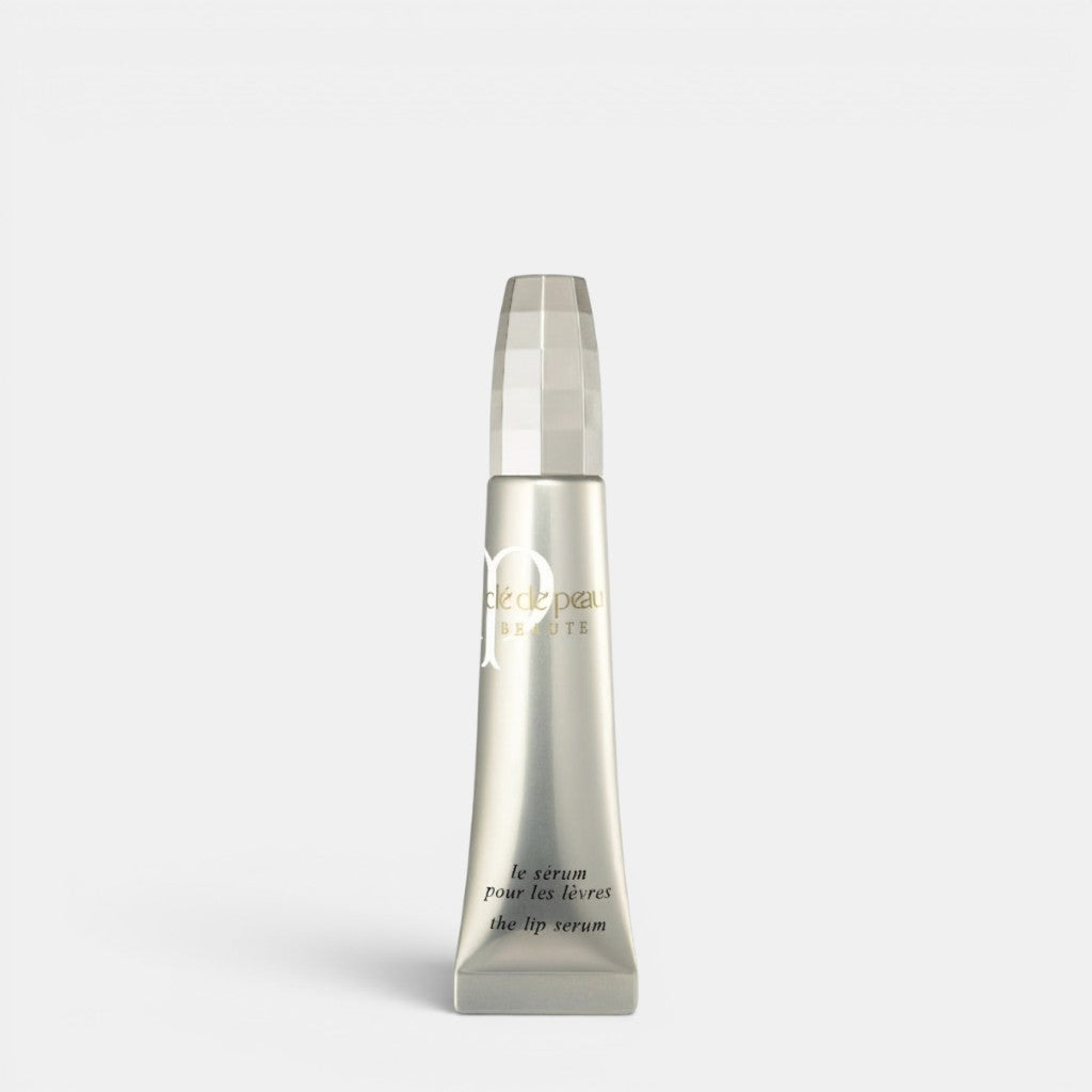 Shop Rescue Spa silver tube lip serum with a faceted cap, promoting plump, hydrated lips.