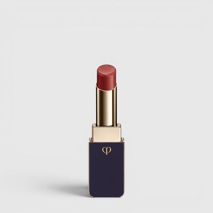 Shop Rescue Spa Lipstick Shine in a deep rose shade with a luminous dewy finish in a sleek navy and gold tube