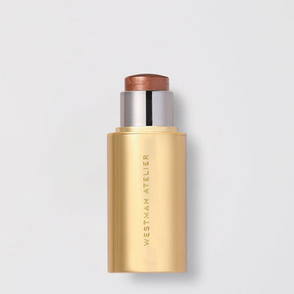 Shop Rescue Spa Lit Up Highlight Stick in a golden bronze shade with a sleek metallic gold tube packaging.
