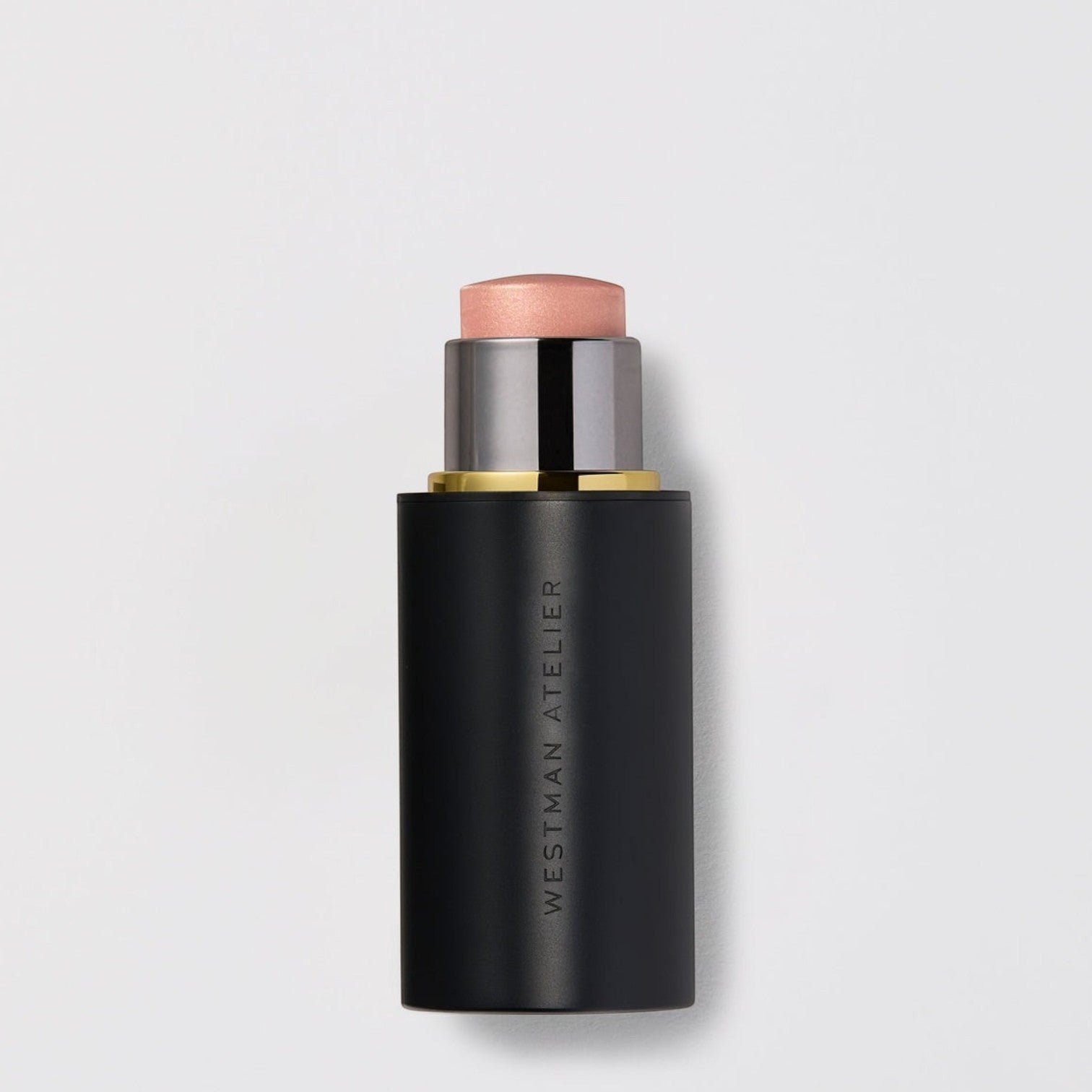 Shop Rescue Spa Lit Up Highlight Stick in a sleek black twist-up tube with a shimmering golden bronze gel balm.