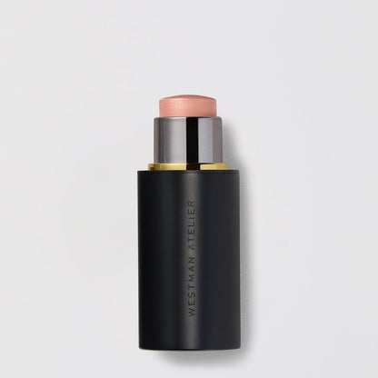 Shop Rescue Spa Lit Up Highlight Stick in a sleek black twist-up tube with a shimmering golden bronze gel balm.
