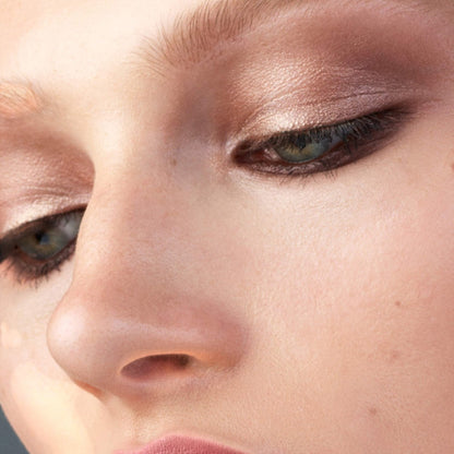 Shop Rescue Spa Eye Pods Les Jours eyeshadow applied on a model showing a luminous, soft brown cream-powder finish.