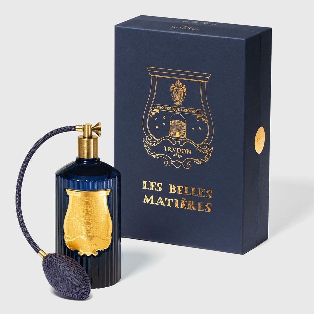 Shop Rescue Spa Madurai room spray in a dark blue fluted glass bottle with a gold emblem and matching gift box.