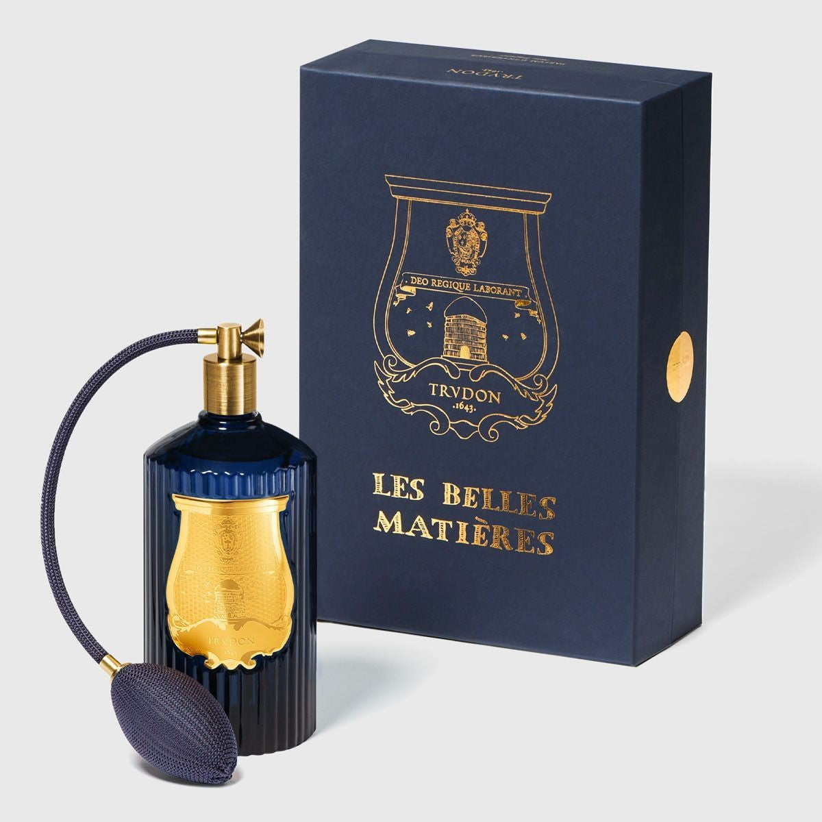 Shop Rescue Spa Madurai room spray in a dark blue fluted glass bottle with a gold emblem and matching gift box.