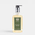 Shop Rescue Spa Magnolia Bloom hand and body wash in a clear rectangular bottle with a black pump dispenser.