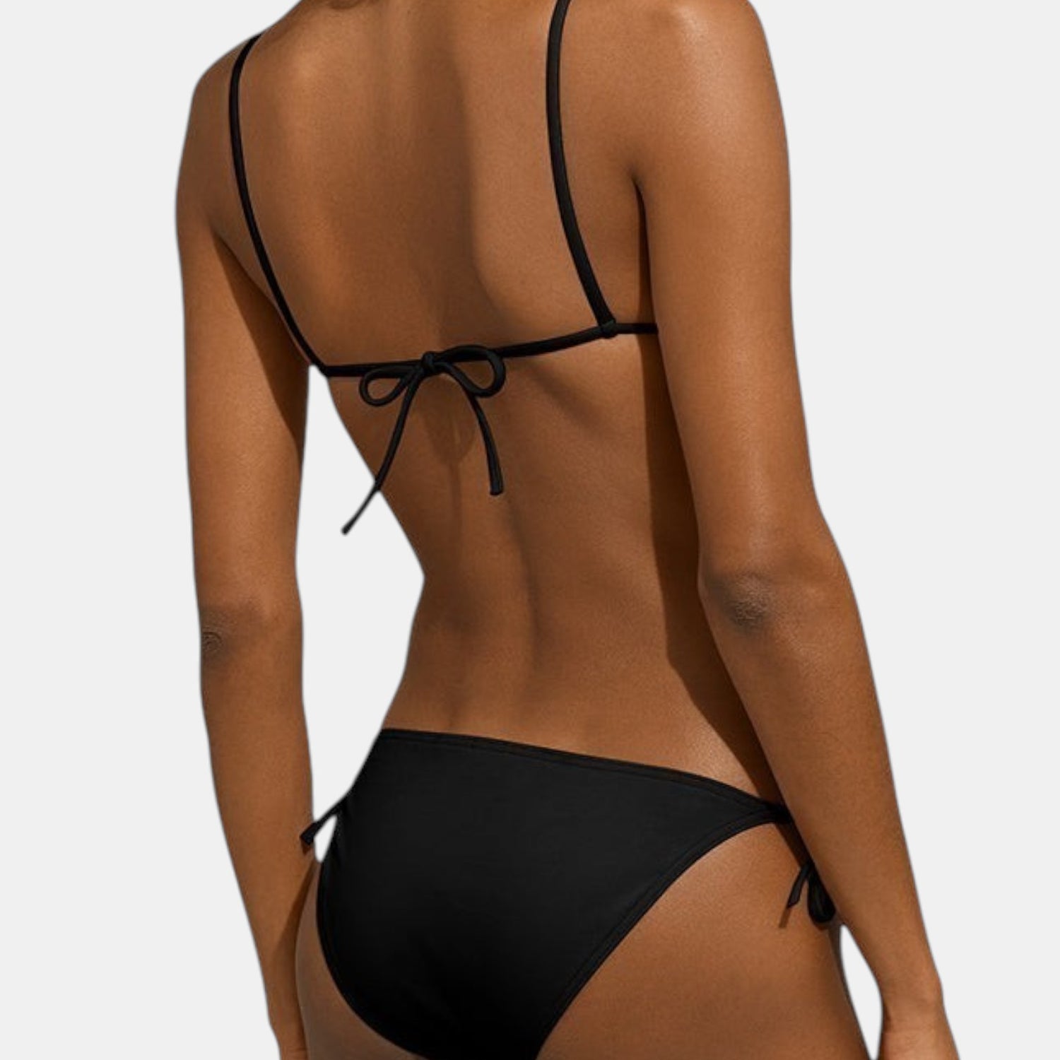 Shop Rescue Spa MALOU black bikini with side ties worn by a model, back view