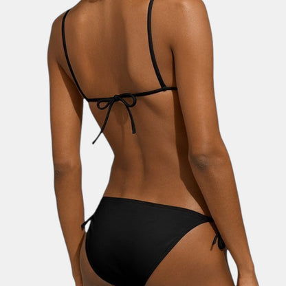 Shop Rescue Spa MALOU black bikini with side ties worn by a model, back view
